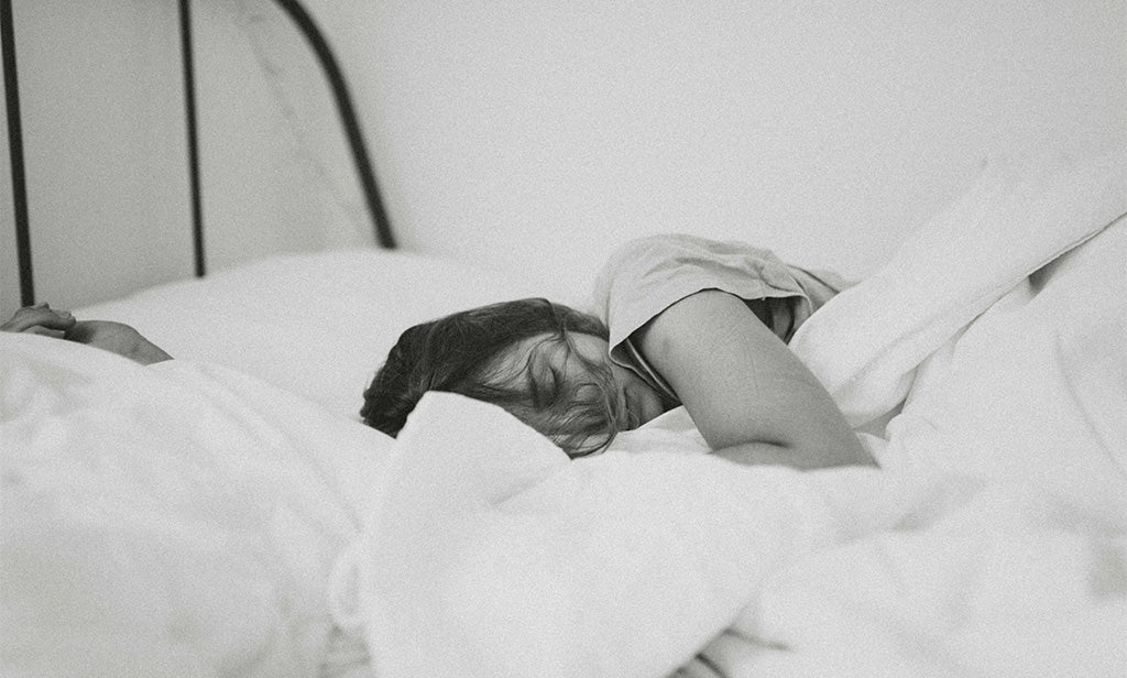 Woman Asleep In Bed